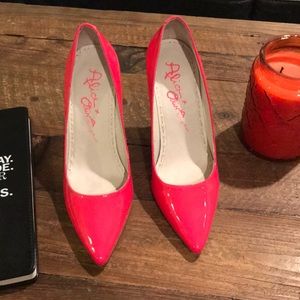 Alice + Olivia bright pink patent leather pumps.